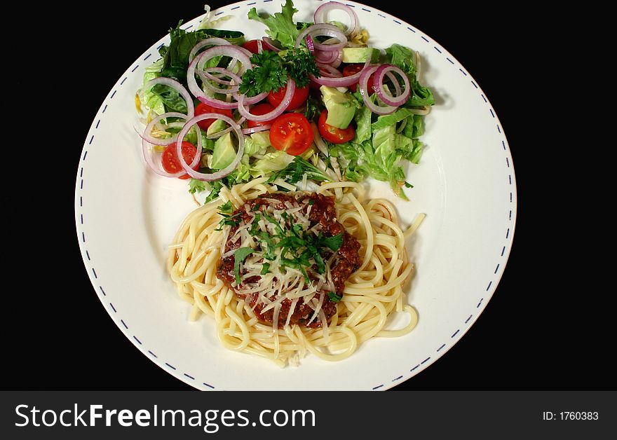 Delicious spaghetti bolognese with side sald ready to serve. Delicious spaghetti bolognese with side sald ready to serve.