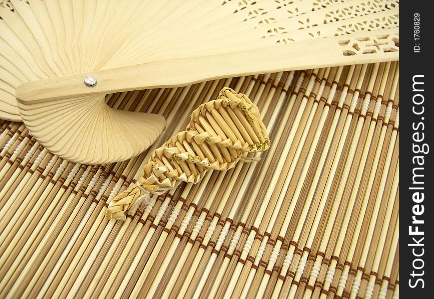 Graceful wooden fan and bamboo napkin. Graceful wooden fan and bamboo napkin