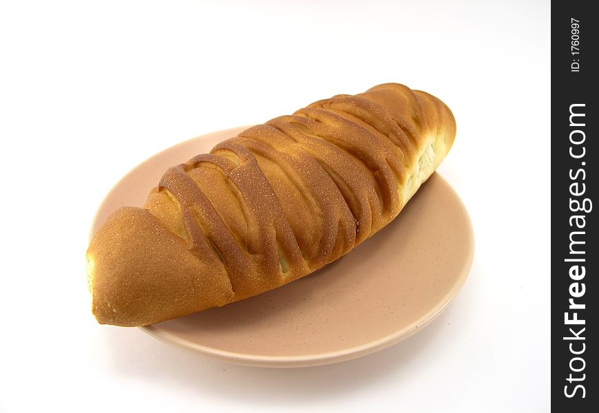 Beautiful bread on a plate on a white background