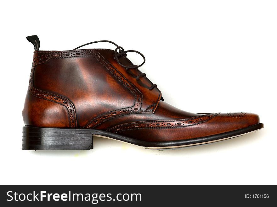 Brown leather boot against a white background. Brown leather boot against a white background