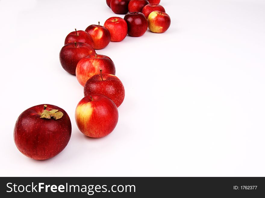 A curved line of apples