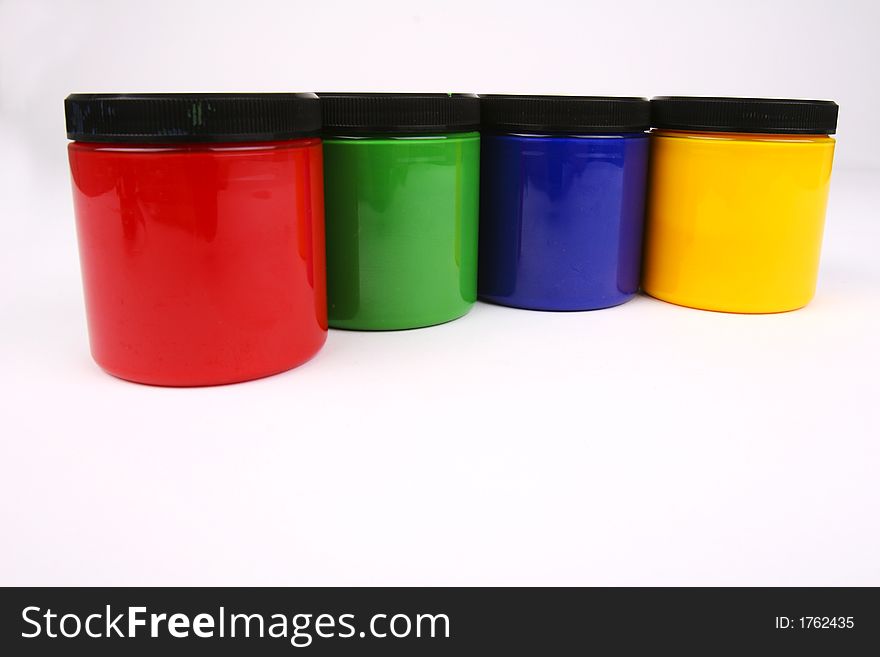 A stack of finger paints in plastic jars