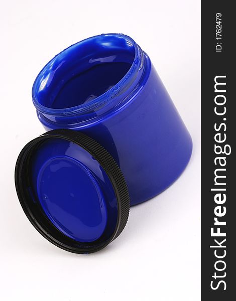 Blue finger paint in a plastic jar