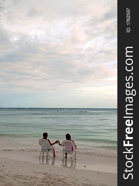 A couple ladies kickin' it on the beach in Mexico. A couple ladies kickin' it on the beach in Mexico