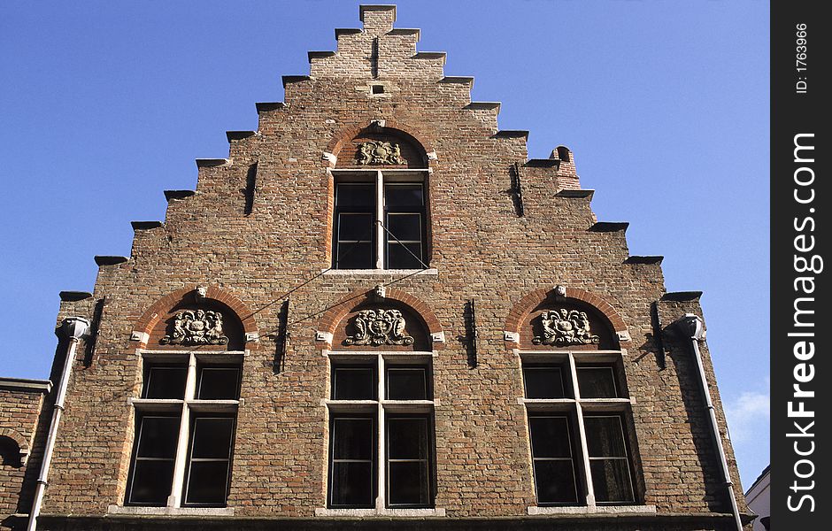 Typical, brick front and gable of an old house of Bruges, Belgium, named the Venice of the North.