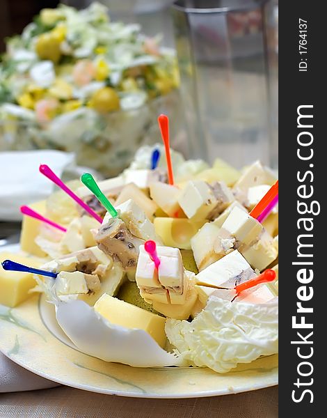 Appetizing snack from different grades of cheese-laying of a celebratory table