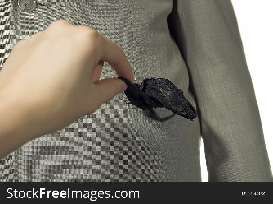 Woman's hand pulls a girl's pantsout of the man's suit pocket (Morning question). Woman's hand pulls a girl's pantsout of the man's suit pocket (Morning question)