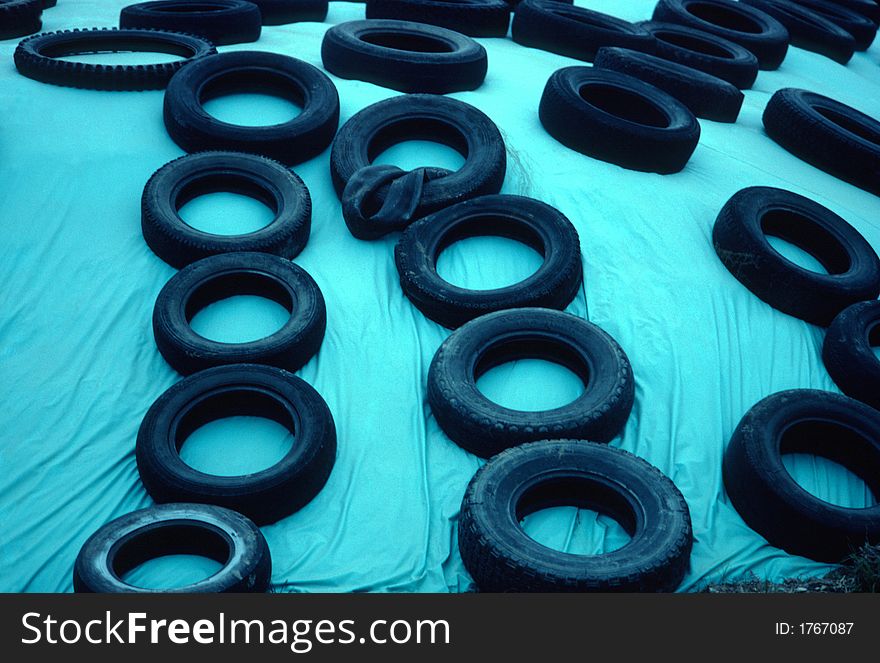 Tires on a blue curtain