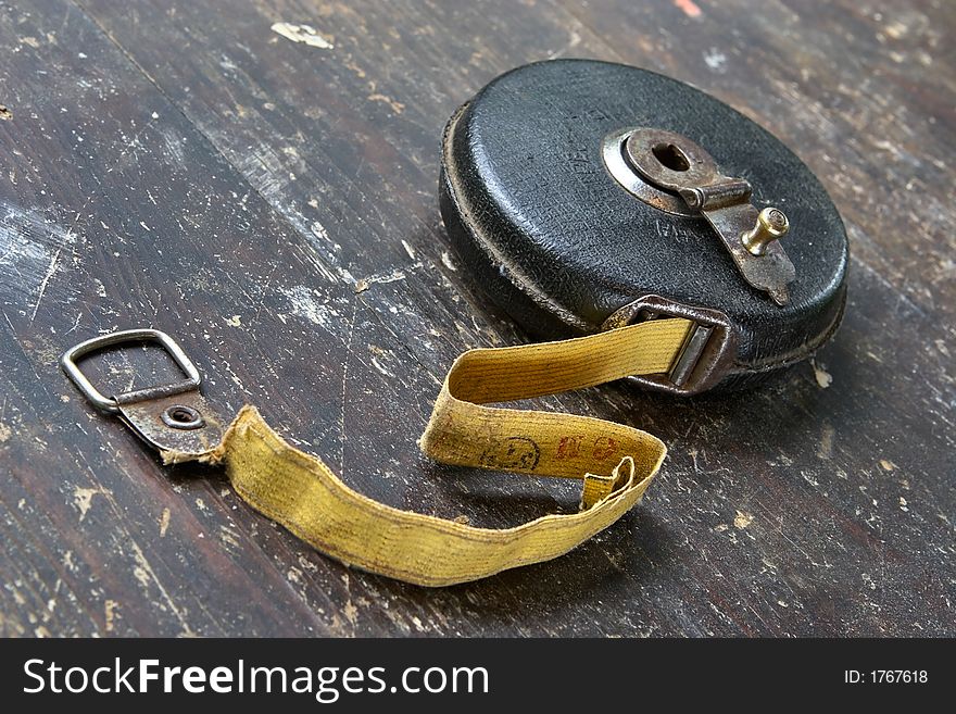 Ancient worn roulette-measuring the device in a shabby condition. Ancient worn roulette-measuring the device in a shabby condition