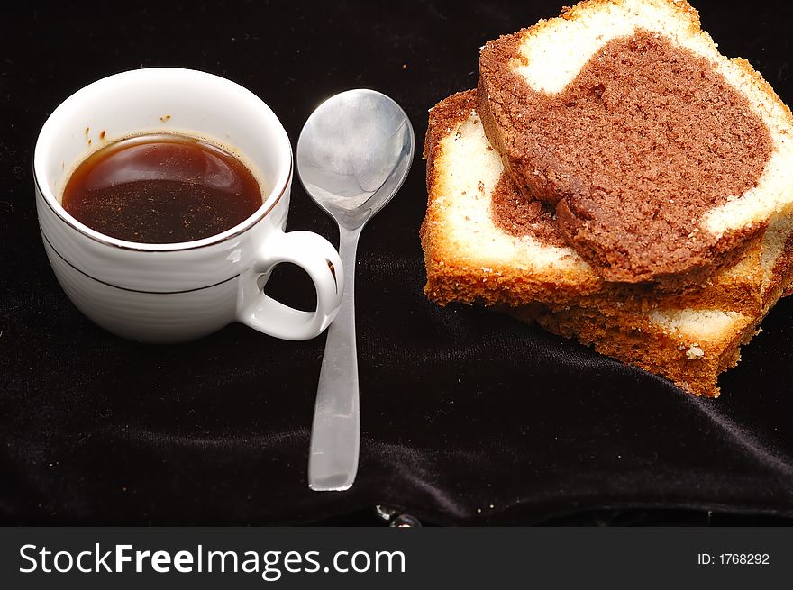 Greek coffee and cake in black velvet background