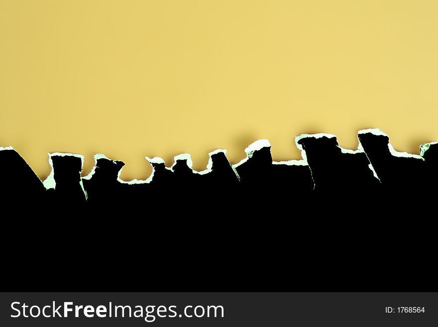 Black card rough jagged tear on a yellow background. Black card rough jagged tear on a yellow background