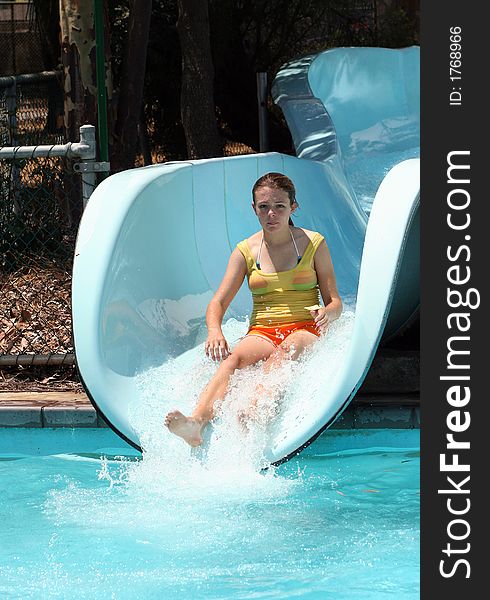 Girl sliding on water slide