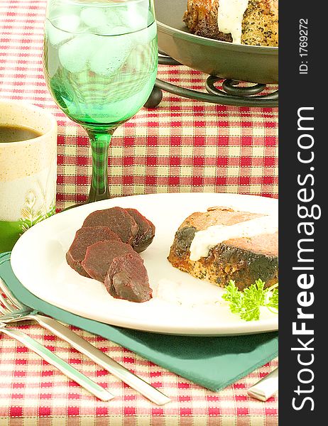 Pork tenderloin served with a white sauce seasoned with salt,pepper and dill.