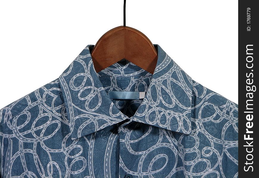 Closeup of a stylish blue shirt on wooden hanger, isolated on white.
