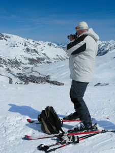 The Man On Skis With A Camera At Ski Resort Royalty Free Stock Images