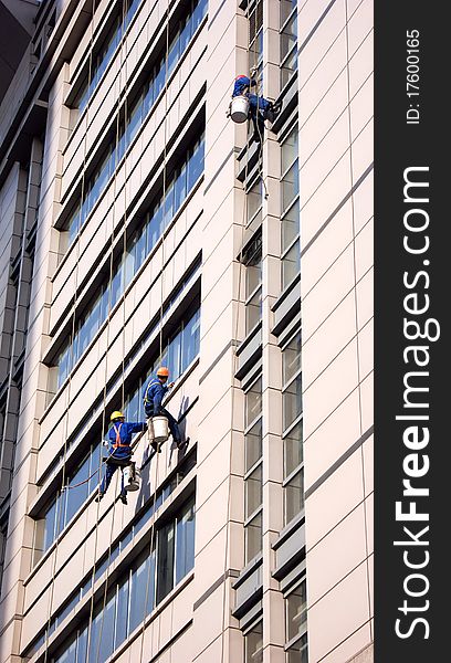 Building Cleaning Workers Cleaning Skyscraper Windows in Shanghai. Building Cleaning Workers Cleaning Skyscraper Windows in Shanghai.