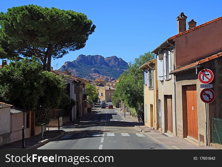 The village of Roquebrune with the Massif D'Roquebrune towering above it, Roquebrune, The Var, France. The village of Roquebrune with the Massif D'Roquebrune towering above it, Roquebrune, The Var, France.