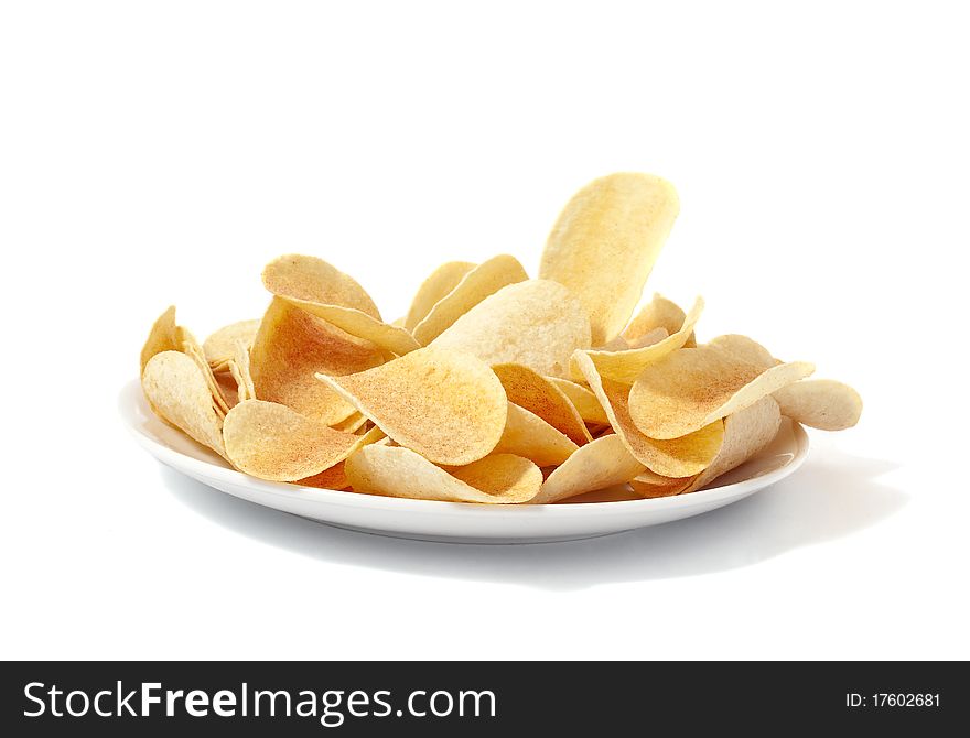 Potato chips on a plate on a white background