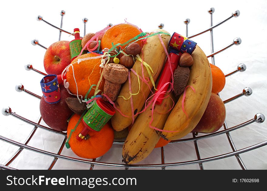 Fruit at a party with party poppers .