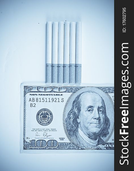 The Costs of a Smoking Habit With A Fake 100 Dollar Bill And Abstract Treatment For Mood