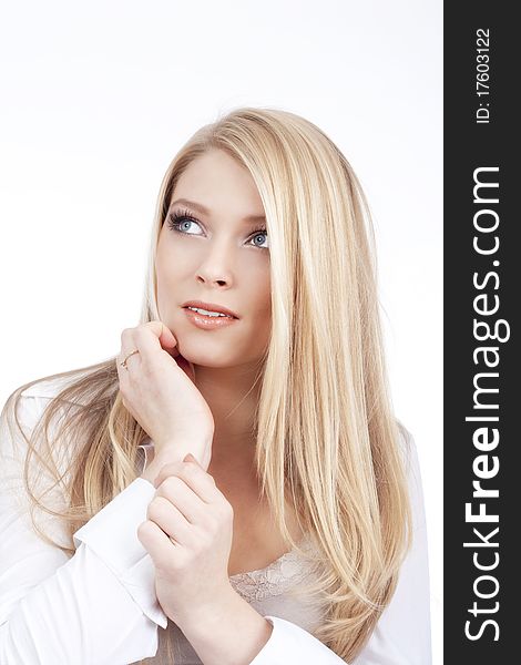 Portrait of a young beautiful blond woman with blue eyes - isolated on white. Portrait of a young beautiful blond woman with blue eyes - isolated on white