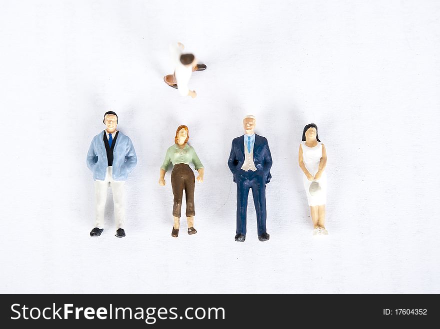 Miniature people on white background. Miniature people on white background