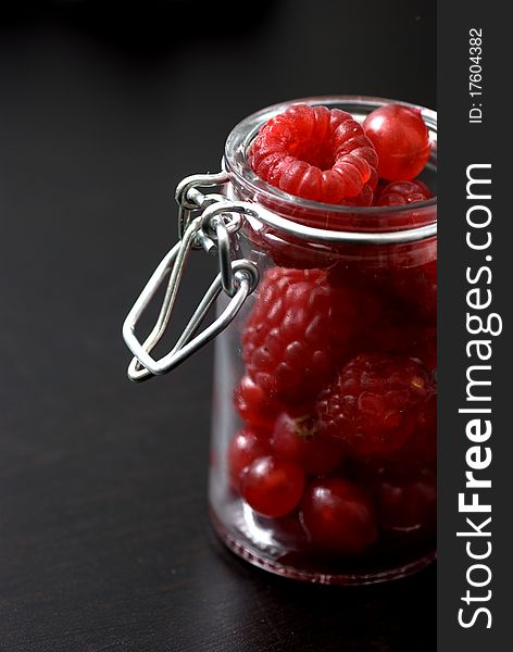 Raspberries in a jar. red fruits