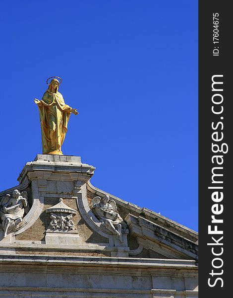 Madonna on top of a church in Assisi