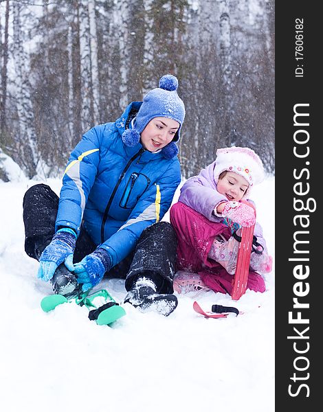 Happy Mother And Daughter In A Winter Park