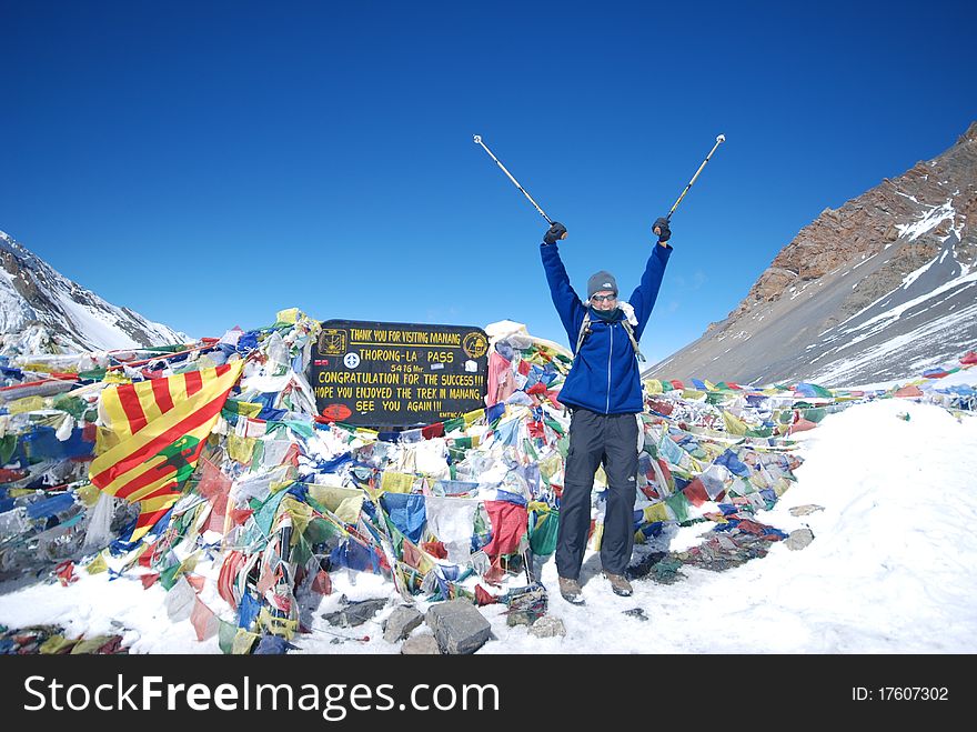 Happy backpacker at the top of a mountain in Nepal. Happy backpacker at the top of a mountain in Nepal