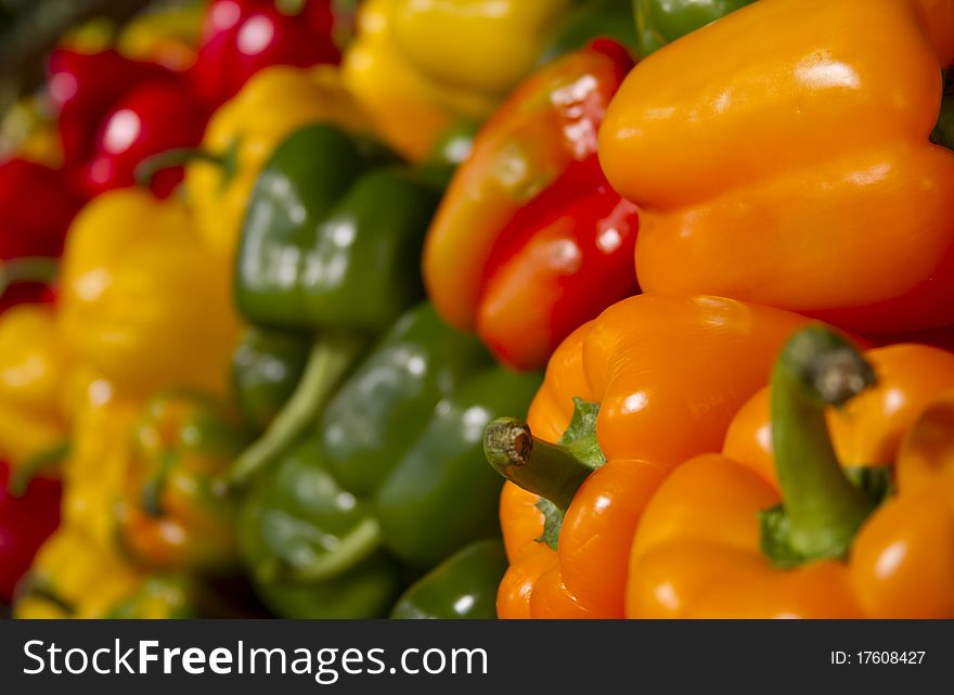 Red peppers, yellow peppers, and green peppers at a local market. Red peppers, yellow peppers, and green peppers at a local market