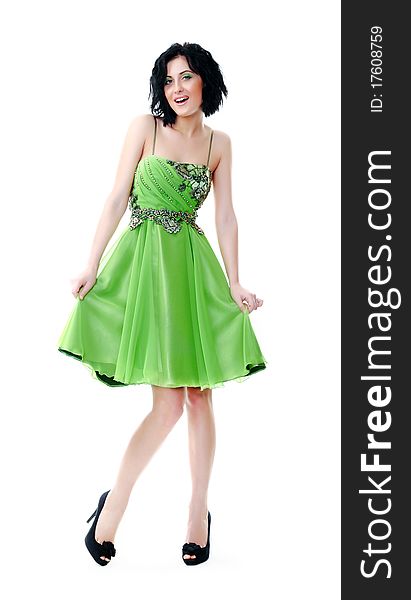 Beautiful young girl posing in a green dress