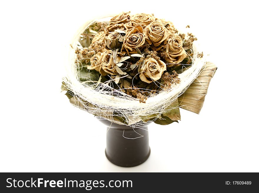 Dried bunch of roses in the vase