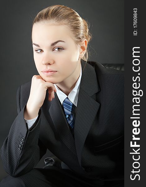 Portrait of the young woman in a man's suit. Portrait of the young woman in a man's suit
