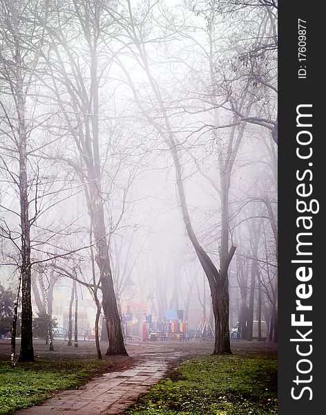 Solitary playground in the foggy countryside park. Solitary playground in the foggy countryside park.