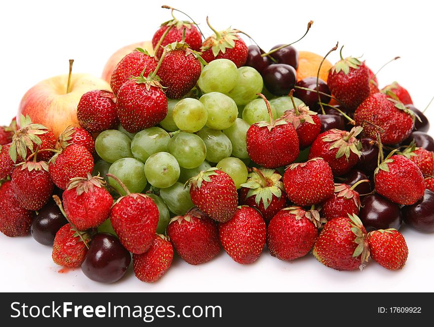 Fresh fruit and berries on a white background
