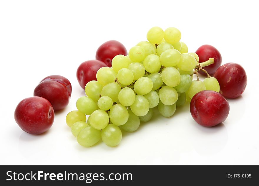 Fresh fruit and berries on a white background