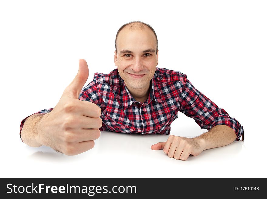 Happy casual young man showing thumb up and smiling isolated on white background