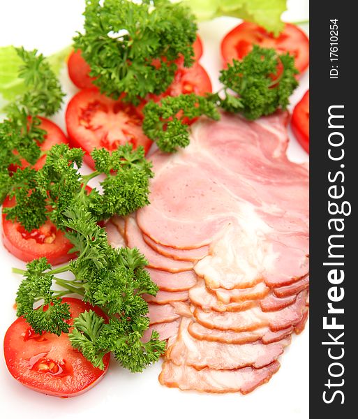 Leaf of salad and ham on a white background. Leaf of salad and ham on a white background