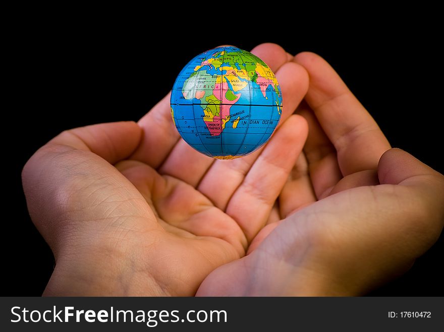 Close up of globe hanging above the palms