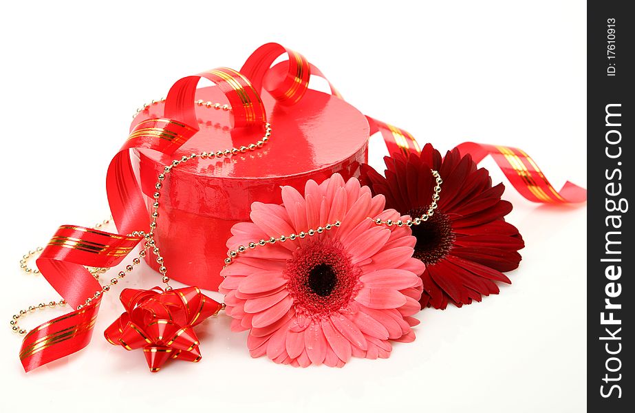 Gift and flower on a white background