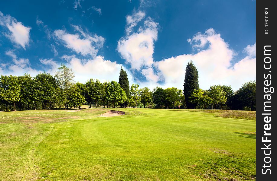 Beautiful golf course surrounded with bunkers