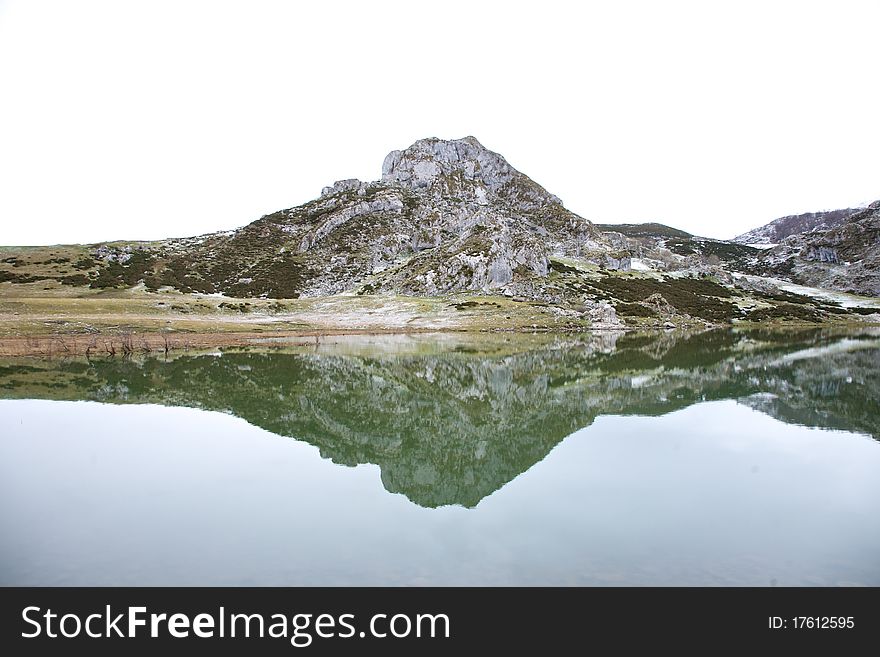 Mountain Reflected At The Water