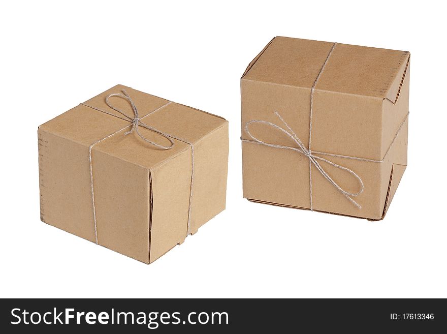 The two packing boxes, tied with rope on a white background