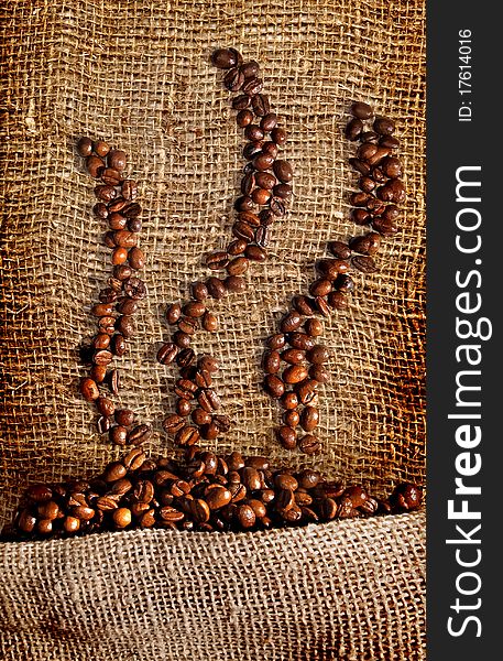 Coffee beans on brown canvas