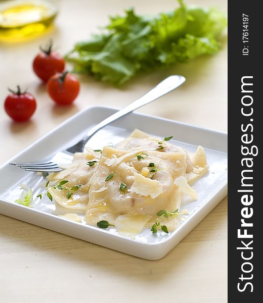 Ravioli with olive oil and cheese sauce