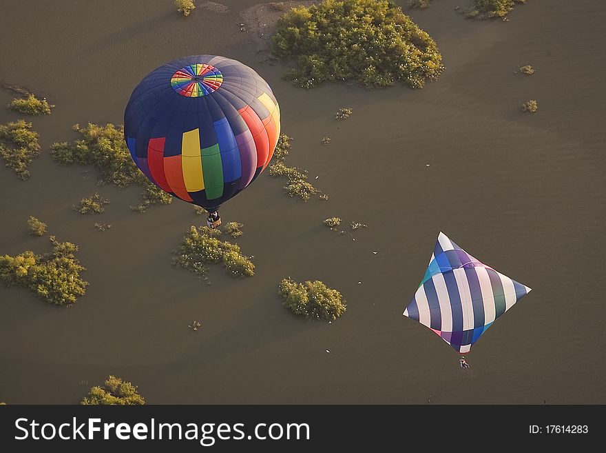 Two Hot Air Balloons Over Water