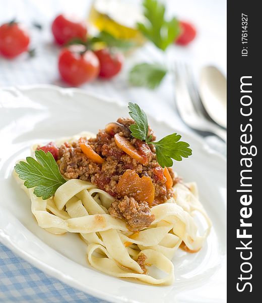 Pasta with meat sauce and parsley