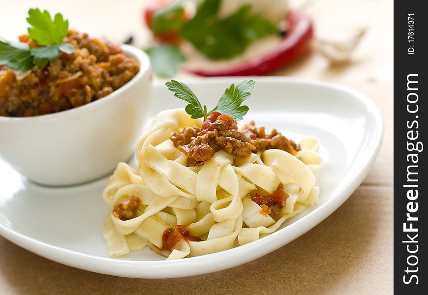 Pasta with meat sauce and parsley