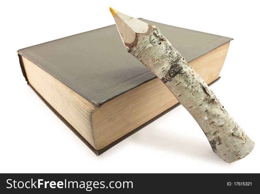 An old book and pencil on a white background